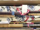 many different types of fishing rods in a box