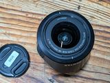 a camera lens sitting on top of a wooden table