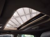 a view of the sunroof from inside of a car