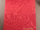the cover of the book is red and has gold lettering on it