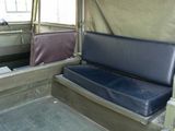 two seats in the back of a military vehicle