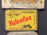 three tins of various types of cigarettes on a table