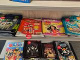 many children ' s books on a shelf in a store