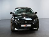 the front view of a black car in a showroom