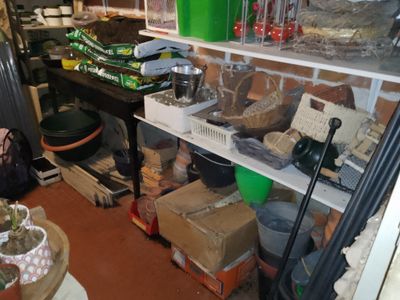 a shelf full of food and other items in a room