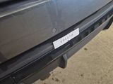 a close up of the bumper of a car with a sticker on it
