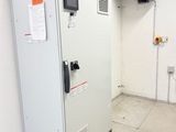 an image of a machine in a room with a fan