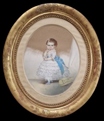 an old picture of a little girl in a blue dress