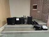 a bunch of electronics sitting on the steps of a building