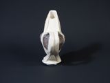 a white vase that has a black and white design on it