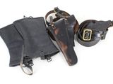 an old pair of leather boots and a leather belt on a white background