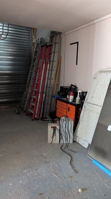 a garage with a lot of junk in it