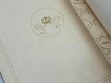 an open book with a design on it on a table