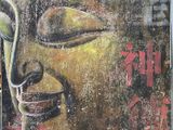 peinture représentant un visage de Bouddha sur la façade d'un immeuble