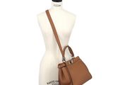 the sak tan leather tote bag on a mannequin mannequin mannequin mannequin mannequin mannequin mannequin mann