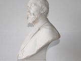 marble bust of a man with a beard and a book