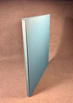 an image of a blue book on a brown surface