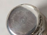 a close up of a silver object on a table