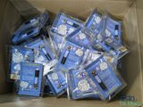 a cardboard box filled with blue and white christmas cards