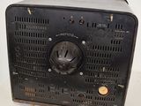 an old black radio sitting on a table