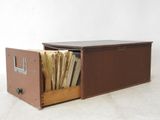 a brown box with a bunch of files inside of it