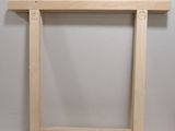a small wooden table with a shelf on it