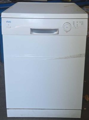 an image of a white dishwasher in a garage