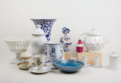 many different types of vases and bowls on the table