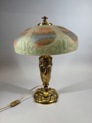 a lamp that is sitting on a table with a light on it