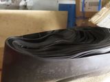 a close up of a black rubber band on a table