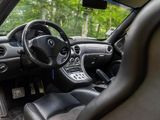 the interior of a car with a steering wheel, dashboard, and dashboard buttons