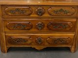 a wooden dresser with a mirror on top of it