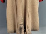 an image of a coat with a fur collar and cuffs on a mannequin stand