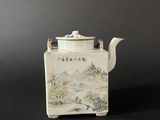 an image of a white tea pot sitting on top of a table