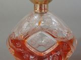 a bottle of perfume sitting on a table