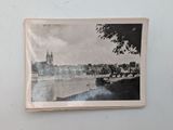 a picture of a black and white photo hanging on a wall