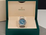 the rolex watch is in the box on the table