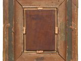 an old wooden picture frame with a tag on it