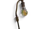 a light that is on the wall next to a lamp