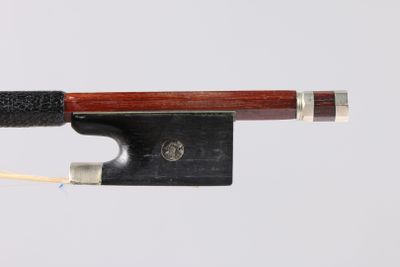 a close up of a violin bow on a white background