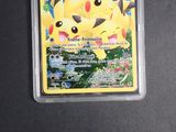 a pokemon card in a plastic case on a table
