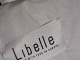 a close up of a label on a white shirt