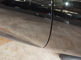 a close up of a car door handle and the door handle of the car