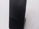 a cell phone that is sitting on top of a stand