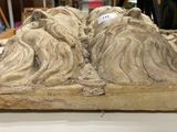 a large stone sculpture of a mountain with a lot of hair