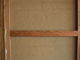 a close up of a picture of a wooden frame on a white sheet