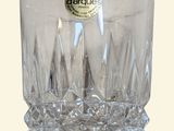 a clear glass vase with a label on it