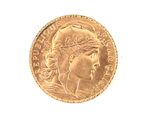 a gold coin with a woman ' s head on it