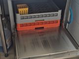an open oven with a basket of food inside of it