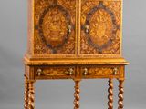 an old wooden cabinet with carvings on the doors and drawers